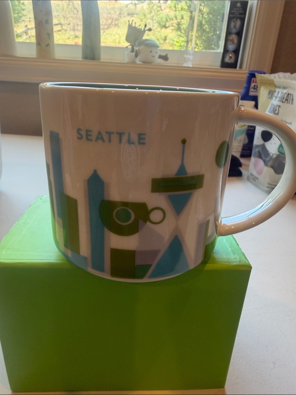 Starbucks you are here 2017 Mug with Green and Blue Seattle Skyline Design